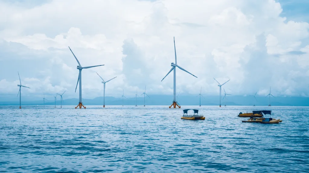Boats in front of wind turbines